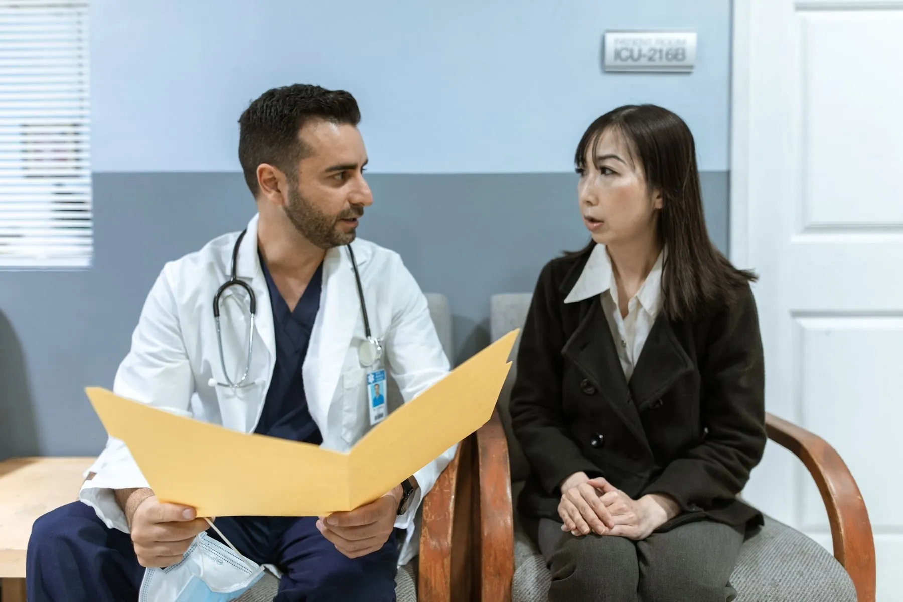 Doctor consulting a patient at Trimmurti Hospital